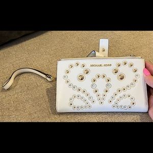 Cream colored Michael Kors wristlet used, but almost PERFECT
